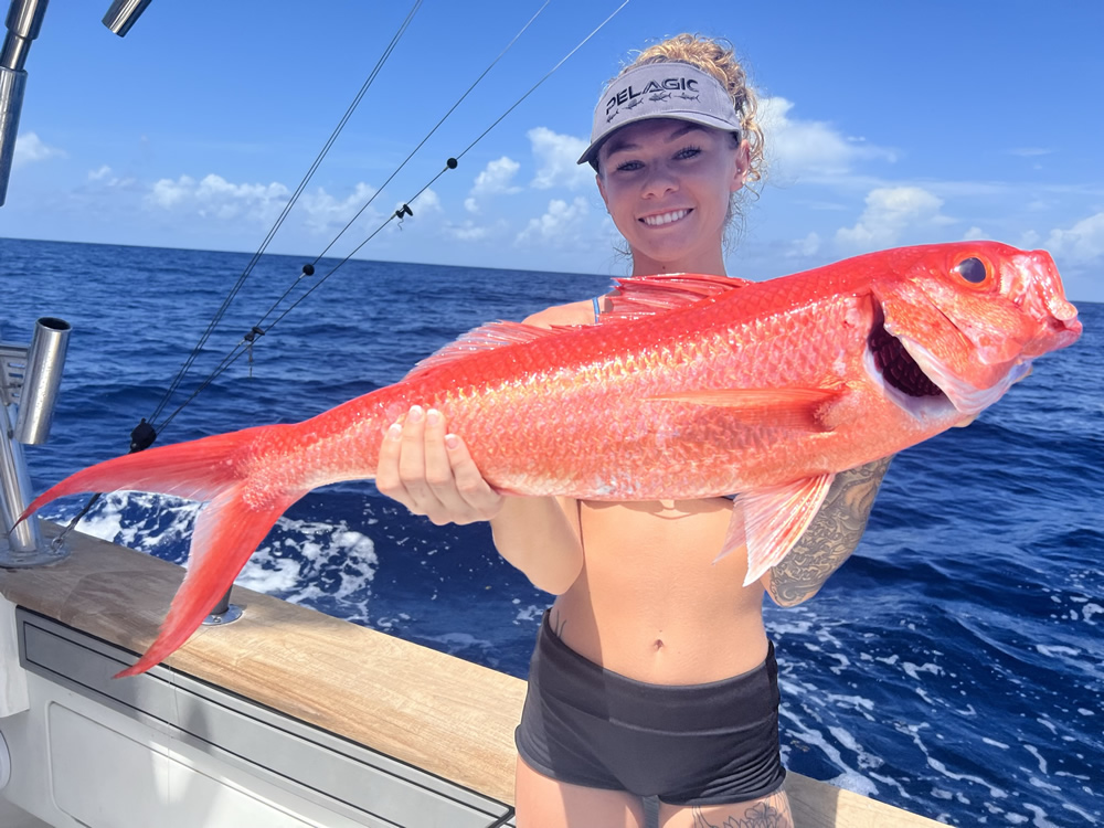 Girl with Queen Snapper