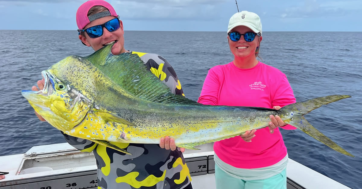 The Greer family with a nice big mahi